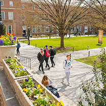 Students walking on quadrangle in spring