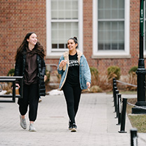 Students walking in front of Smith Auditorium