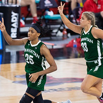 Women's basketball players running down the court