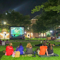 Photo of students watching a movie on the quad