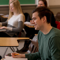 Student sitting at desk in classroom