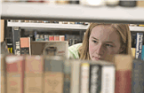 girl looking for book